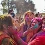 People play with colours to celebrate the festival of Holi, in Gorakhpur