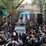 A vehicle carrying former Prime Minister Imran Khan is surrounded by his supporters as he leaves for Islamabad from his residence in Lahore, Pakistan, Saturday, March 18, 2023. A top Pakistani court on Friday suspended an arrest warrant for Khan, giving him a reprieve to travel to Islamabad and face charges in a graft case without being detained. AP/PTI(AP03_18_2023_000086A)